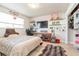 Well-lit bedroom with organized shelving, a computer desk, and ample workspace at 2821 Coral Way, Punta Gorda, FL 33950