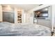 Bedroom showcases a large TV, access to closet with built-in shelving and secured safe at 2821 Coral Way, Punta Gorda, FL 33950