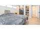 Bedroom features a secure safe, a closet with built-in shelving, and hardwood floors at 2821 Coral Way, Punta Gorda, FL 33950