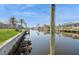 Picturesque canal view with lush landscaping and well-maintained docks and homes at 2821 Coral Way, Punta Gorda, FL 33950