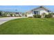 Lovely single-story home with manicured green lawn and a stylish light-blue metal roof at 2821 Coral Way, Punta Gorda, FL 33950