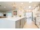 Stylish kitchen with a large island, stainless steel appliances, and pendant lighting at 2821 Coral Way, Punta Gorda, FL 33950