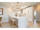 Bright kitchen boasts quartz countertops, white cabinetry, and modern pendant lighting at 2821 Coral Way, Punta Gorda, FL 33950