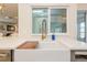 Kitchen sink detail with a view to the living room at 2821 Coral Way, Punta Gorda, FL 33950