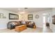 Cozy living room with a comfortable leather sectional, hardwood floors, and lots of natural light at 2821 Coral Way, Punta Gorda, FL 33950