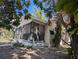 Charming single-story home featuring a screened front porch and mature trees at 3201 N 15Th St, Tampa, FL 33605