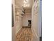 Walk in storage room featuring wire shelving and wood-look floors at 3801 Bramblewood Blvd, Land O Lakes, FL 34639