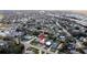 An aerial view shows the property surrounded by streets, houses, and trees in a neighborhood at 4810 Haines N Rd, St Petersburg, FL 33714