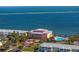 A high angle view of the waterfront property showcasing the ocean with a pool, docks, and landscaping at 5092 Beach Se Dr # D, St Petersburg, FL 33705