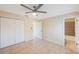 Spacious bedroom features tiled floors, a ceiling fan and a large closet at 5092 Beach Se Dr # D, St Petersburg, FL 33705