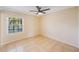 Bedroom featuring a ceiling fan, tiled floors and a window at 5092 Beach Se Dr # D, St Petersburg, FL 33705