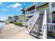 Charming two-story home featuring outdoor stairs and beautiful landscaping at 5092 Beach Se Dr # D, St Petersburg, FL 33705