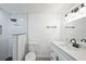 Modern bathroom features walk-in shower and vanity with storage at 6304 Seabreeze Dr, Port Richey, FL 34668