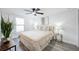 Bright bedroom with light colored walls and flooring with large window at 6304 Seabreeze Dr, Port Richey, FL 34668