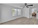 Bright bedroom with fan, closet and window view of the pool at 6304 Seabreeze Dr, Port Richey, FL 34668