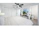 Comfortable bedroom featuring a ceiling fan, closet, and bright natural light at 6304 Seabreeze Dr, Port Richey, FL 34668