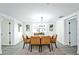 Dining room with modern light fixture and six chairs at 6304 Seabreeze Dr, Port Richey, FL 34668