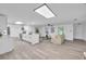 Inviting open-concept living area with a view of the modern kitchen and dining space at 6304 Seabreeze Dr, Port Richey, FL 34668