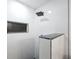 Modern shower featuring white tile, a black rainfall shower head and a custom tile inset niche at 6304 Seabreeze Dr, Port Richey, FL 34668