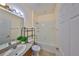 Bright bathroom features a shower-tub combo, and a single sink vanity with a stone counter top at 715 Parker Den Dr, Ruskin, FL 33570