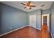 Bedroom with hardwood floors, closet, and neutral paint at 715 Parker Den Dr, Ruskin, FL 33570