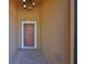 Welcoming front entrance features a covered porch and decorative chandelier, adding a touch of elegance at 715 Parker Den Dr, Ruskin, FL 33570