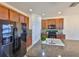 Modern kitchen featuring granite countertops, wood cabinets, and black appliances at 715 Parker Den Dr, Ruskin, FL 33570