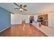 Bright and airy living space with wood floors connects the kitchen to the living room at 715 Parker Den Dr, Ruskin, FL 33570