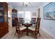 Cozy dining area with a glass-topped table and four chairs at 2016 E View Dr, Sun City Center, FL 33573