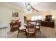 Cozy dining area with a round glass table, decorative chairs, and an elegant chandelier at 2016 E View Dr, Sun City Center, FL 33573