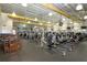 Spacious gym with modern fitness equipment, including treadmills, weights, and rowing machines at 2016 E View Dr, Sun City Center, FL 33573