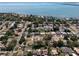 Aerial view of a waterfront community with mature trees and homes with swimming pools at 2391 66Th S Ter, St Petersburg, FL 33712