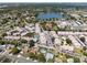 Aerial view of a community featuring a lake, recreation area and numerous residences at 2391 66Th S Ter, St Petersburg, FL 33712