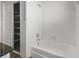 Bright bathroom featuring a shower-over-tub combination and built in storage at 2391 66Th S Ter, St Petersburg, FL 33712