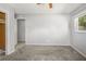 Bedroom features neutral paint, carpet, and a closet for storage at 2391 66Th S Ter, St Petersburg, FL 33712