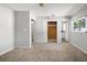 Bedroom featuring closet, neutral walls, and adjacent bathroom at 2391 66Th S Ter, St Petersburg, FL 33712