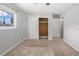 Bedroom includes a closet, natural light, and neutral carpet at 2391 66Th S Ter, St Petersburg, FL 33712