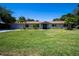 Well-maintained single-story home features a lush green lawn and inviting curb appeal at 2391 66Th S Ter, St Petersburg, FL 33712