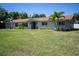 Charming single-story home with a well-manicured lawn and tropical landscaping at 2391 66Th S Ter, St Petersburg, FL 33712