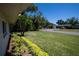 Expansive front lawn with well-kept grass and vibrant landscaping, enhancing curb appeal at 2391 66Th S Ter, St Petersburg, FL 33712