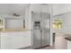 Spacious kitchen area with stainless steel refrigerator and breakfast bar at 2391 66Th S Ter, St Petersburg, FL 33712