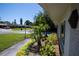 Well-maintained landscaping with a mix of lush greenery and colorful flowers along the sidewalk at 2391 66Th S Ter, St Petersburg, FL 33712