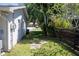 Side yard with access door and privacy fence at 2391 66Th S Ter, St Petersburg, FL 33712