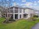 Exterior of the building featuring well-manicured lawn and screened in porch area at 4502 Southampton Ct # 4502, Tampa, FL 33618