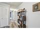 Hallway features wood-look floors, closet, and a decorative bookshelf at 4502 Southampton Ct # 4502, Tampa, FL 33618