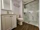 Modern bathroom featuring new vanity, LED mirror, and frameless glass shower enclosure at 821 Deleon Ct # 108, Dunedin, FL 34698