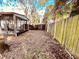 Backyard with a wooden fence and screened patio at 2734 53Rd N Ave, St Petersburg, FL 33714