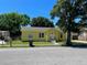 Charming yellow house with a spacious yard and detached garage at 2734 53Rd N Ave, St Petersburg, FL 33714