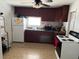 Kitchen with dark cabinets and a four-burner stove at 2734 53Rd N Ave, St Petersburg, FL 33714