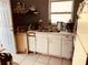 Kitchen with white cabinets and double sink at 2734 53Rd N Ave, St Petersburg, FL 33714